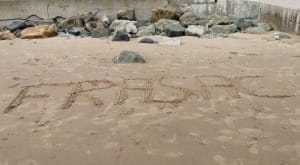 FRASAC written in sand
